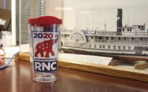 A piece of RNC 2020 memorabilia displayed Thursday, Oct. 22, 2020, in Jacksonville, Fla., commemorates an event that never took place. Republican plans to hold part of its political convention in Jacksonville, in August were scuttled because of concerns over the coronavirus pandemic. (AP Photo/Bobby Caina Calvan)