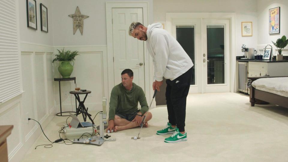 Brooks Koepka does a little indoor putting practice. (Netflix)