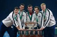 Tennis - Belgium v Great Britain - Davis Cup Final - Flanders Expo, Ghent, Belgium - 29/11/15 Men's Singles - Great Britain's Jamie Murray, James Ward, Kyle Edmund, Andy Murray and captain Leon Smith celebrate with the trophy after winning the Davis Cup Action Images via Reuters / Jason Cairnduff