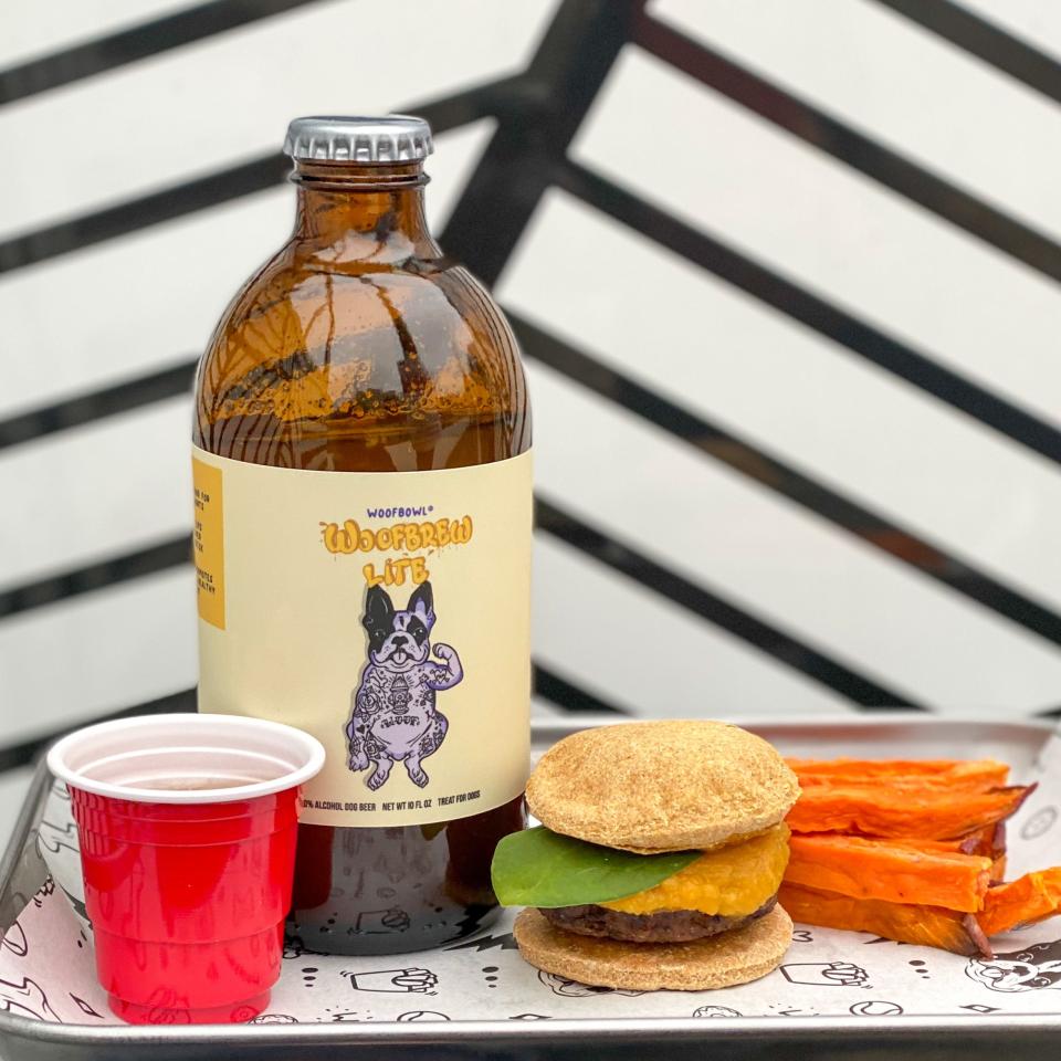 Woofbowl's menu includes Woofbrew Lite Doggy Beer, a burger and sweet potato fries.