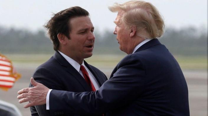 Ron DeSantis shakes then-President Donald Trump’s hand in May 2019. 