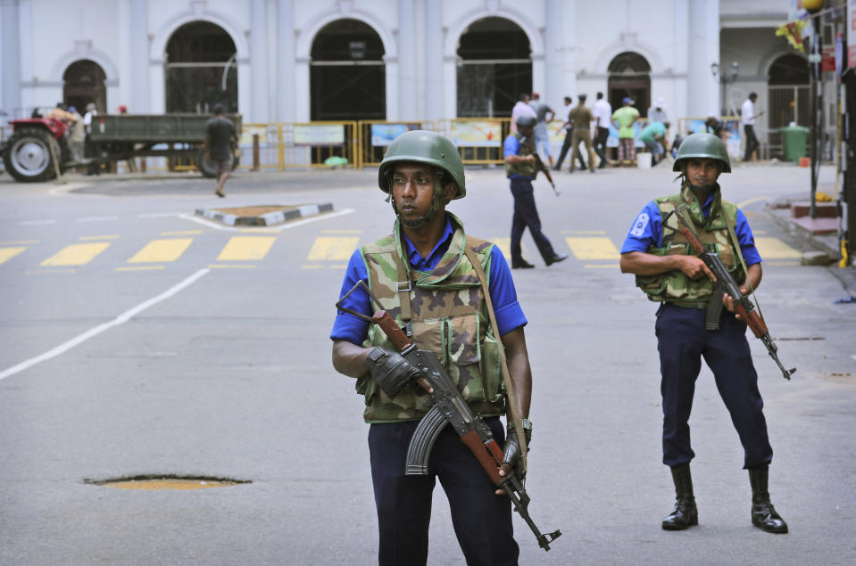 Sri Lankan Naval soldiers stand guard outside St. Anthony's Church in Colombo, Sri Lanka, Monday, April 29, 2019. The Catholic Church in Sri Lanka says the government should crack down on Islamic extremists with more vigor "as if on war footing" in the aftermath of the Easter bombings meanwhile the government has banned all kinds of face coverings that may conceal people's identities. The emergency law, which took effect Monday, prevents Muslim women from veiling their faces. (AP Photo/Manish Swarup)