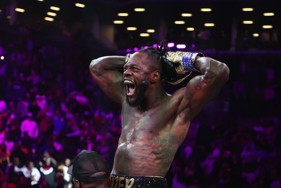 BROOKLYN, NEW YORK - OCTOBER 15:  Deontay Wilder celebrates after knocking out Robert Helenius in the first round during their WBC world heavyweight title eliminator bout at Barclays Center on October 15, 2022 in Brooklyn, New York. (Photo by Al Bello/Getty Images)