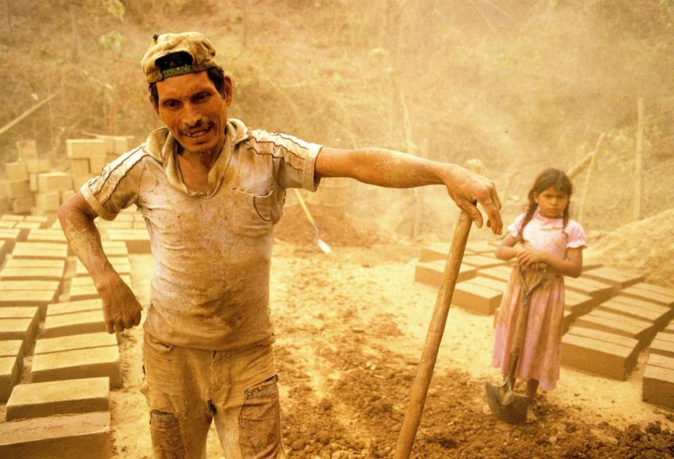 <div class="inline-image__caption"><p>A peasant man and daughter make adobe blocks for building their new home.</p></div> <div class="inline-image__credit">Courtesy Bill Gentile</div>