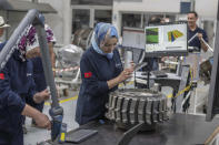 Women workers repair aircraft parts inside Safran Aircraft Engines repair plant outside of Casablanca, Morocco, Thursday, April 18, 2024. Moroccan officials are aiming to turn the country into an aerospace hub, luring investors and manufacturers who have aimed to spread out their supply chains and find willing workers since the COVID-19 pandemic. (AP Photo)