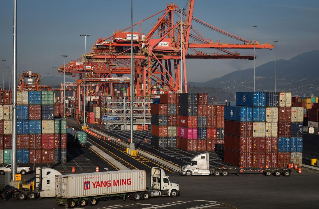 Vancouver, Canada. 14th Oct, 2022. Statistics Canada says the country posted a merchandise trade deficit of $1.1 billion in August as lower oil prices weighed on exports. A truck carries a cargo container at the Port of Vancouver Centerm container terminal in Vancouver, on Friday, Oct. 14, 2022. Credit: The Canadian Press/Alamy Live News