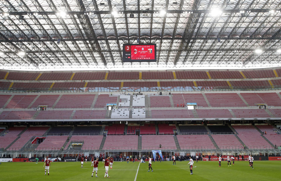 A view of the empty stadium during the Serie A soccer match between AC Milan and Genoa at the San Siro stadium, in Milan, Italy, Sunday, March 8, 2020. Serie A played on Sunday despite calls from Italy’s sports minister and players’ association president to suspend the games in Italy’s top soccer division. (AP Photo/Antonio Calanni)