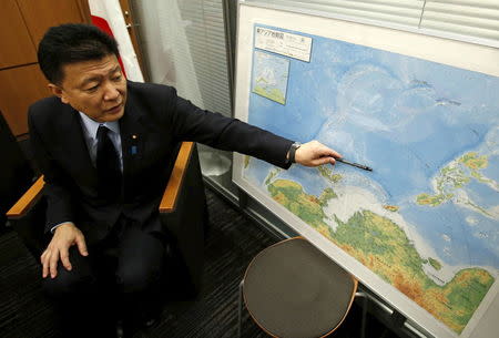 Yoshitaka Shindo, a conservative ruling party lawmaker and grandson of Tadamichi Kuribayashi, commander of the Japanese troops who fought and died in the battle of Iwo Jima, points at a map of south east Asia including Iwo Jima as he speaks during an interview with Reuters in Tokyo March 18, 2015. REUTERS/Yuya Shino