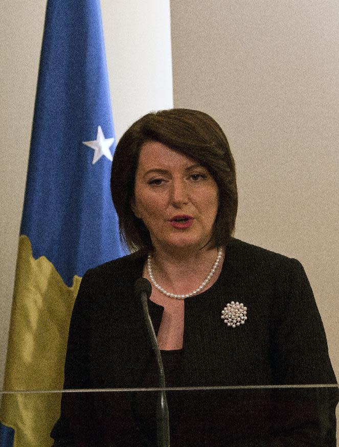 Kosovo President Atifete Jahjaga announces during a press conference the creation of a war crimes tribunal in capital Pristina on Friday, Apr. 11, 2014. Jahjaga spoke after meeting top political leaders and said she will address the issue in a letter to EU's Catherine Ashton. The decision needs approval from Kosovo's 120 seat parliament. (AP Photo/Visar Kryeziu)