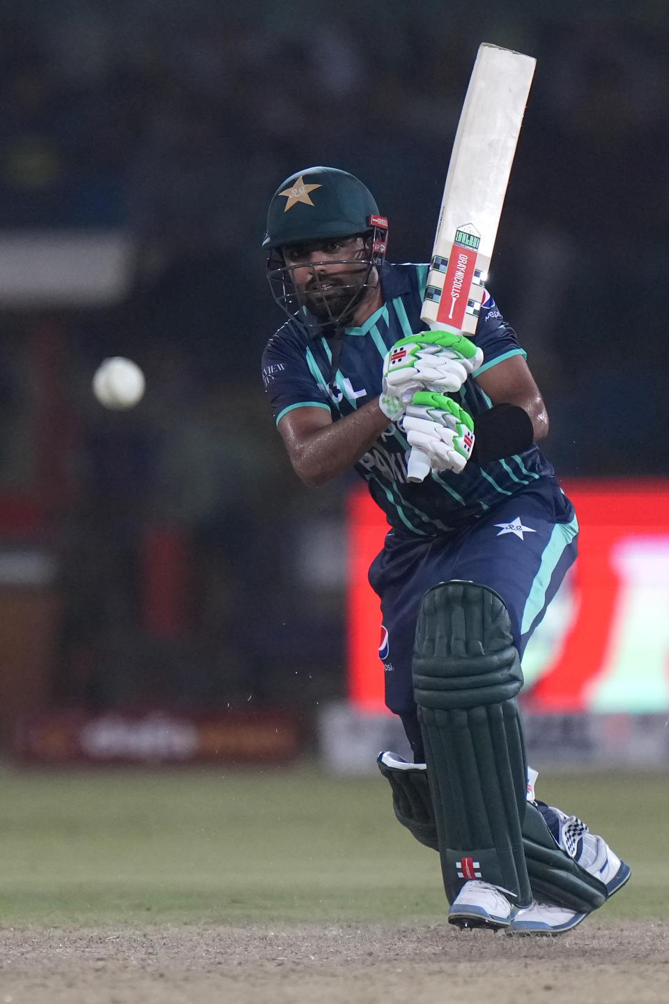 Pakistan's captain Babar Azam plays a shot during the second T20 cricket match between Pakistan and England, in Karachi, Pakistan, Thursday, Sept. 22, 2022. (AP Photo/Anjum Naveed)