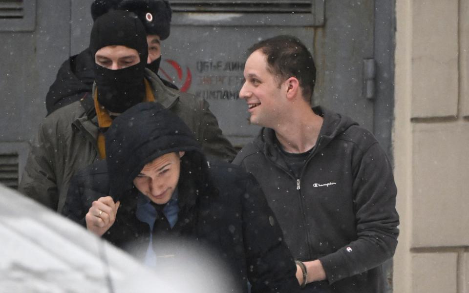 Evan Gershkovich is escorted out of Moscow's Lefortovsky court after the hearing