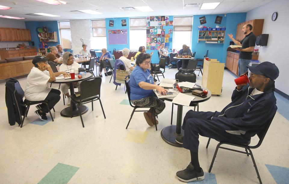 Pastor Mike Watson, Trinity Baptist Church, leads the Fairy Grandparents in Bible studies during the groups meeting at the Lewis Street YMCA Neighborhood Center Friday, May 3, 2024 in Rochester.