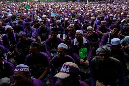 Supporters attend a rally to support the adoption of a strict Islamic penal code at Padang Merbok in Kuala Lumpur, Malaysia, February 18, 2017. REUTERS/Athit Perawongmetha