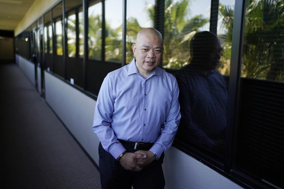 Sonny Vinuya poses for a portrait Tuesday, July 7, 2020, in Las Vegas. Vinuya, a Filipino-American businessman in Las Vegas, hasn't decided if he'll vote again for Donald Trump in the battleground state of Nevada. (AP Photo/John Locher)