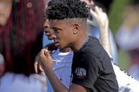 <p>Students released from a lockdown walk away following a shooting at Marjory Stoneman Douglas High School in Parkland, Fla., on Feb. 14, 2018. (Photo: John McCall/South Florida Sun-Sentinel via AP) </p>