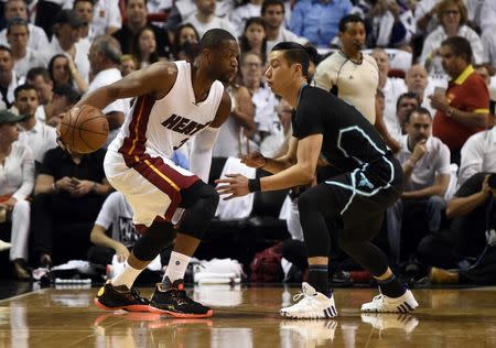 May 1, 2016; Miami, FL, USA; Miami Heat guard Dwyane Wade (3) is pressured by Charlotte Hornets guard Jeremy Lin (7) during the first half in game seven of the first round of the NBA Playoffs at American Airlines Arena. Mandatory Credit: Steve Mitchell-USA TODAY Sports / Reuters Picture Supplied by Action Images