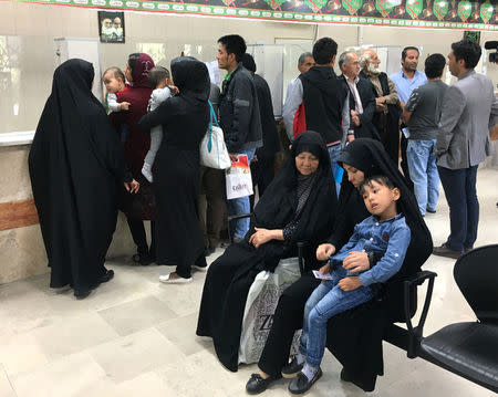 People wait in line at the Soleimankhani centre for refugees in Tehran, Iran, October 24, 2016. REUTERS/Gabriela Baczynska