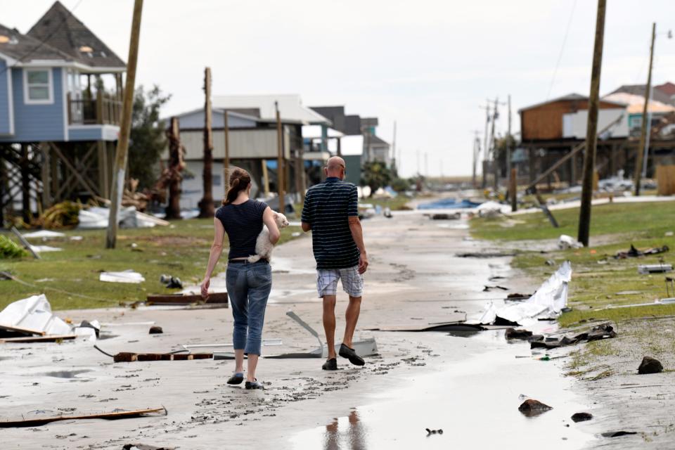 Residents take in the widespread destruction in Holly Beach, Louisiana, on Aug. 27, 2020, the day Hurricane Laura hit the Gulf Coast as a Category 4 storm