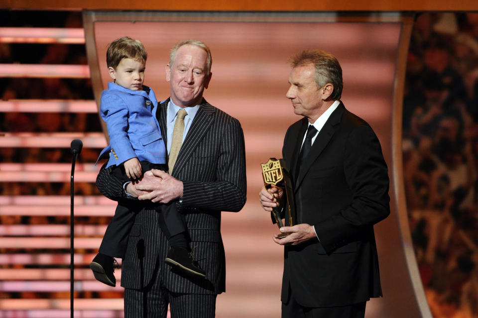 Former NFL quartetrback Joe Montana, right, presents the award for AP Most Valuable Player to Archie Manning and Marshall Manning, on behalf of Denver Broncos quarterback Peyton Manning, son of Archie Manning, at the third annual NFL Honors at Radio City Music Hall on Saturday, Feb. 1, 2014, in New York. (Photo by Evan Agostini/Invision for NFL/AP Images)