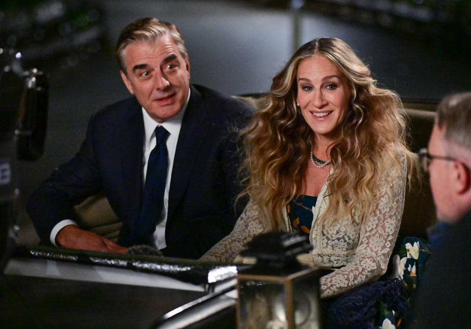 Chris and Sarah Jessica Parker speaking to a man in a scene from And Just Like That