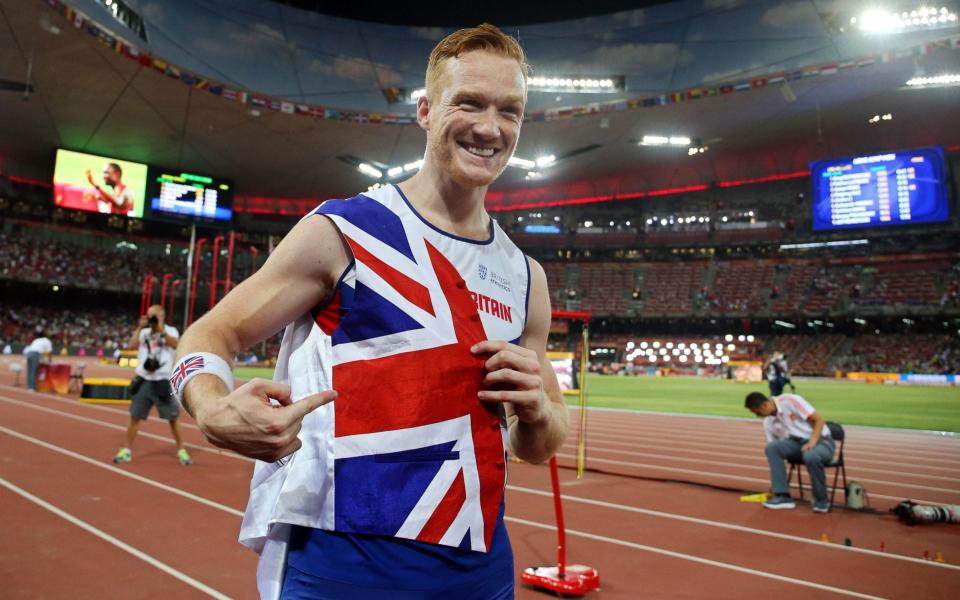 Britain's Greg Rutherford celebrates after winning the gold medal in the men's Long Jump final during the Beijing 2015 IAAF World Championships at the National Stadium, also known as Bird's Nest - Credit:  EPA