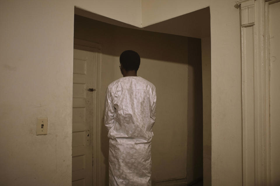 Abdoul, 32 year-old migrant from Maghama, Mauritania poses for a photograph at his shared apartment on Friday, Oct. 6, 2023, in New York. Abdoul traveled from Mauritania to New York via Istanbul, Bogota, El Salvador, Nicaragua, Honduras, Guatemala, Mexico and crossed the U.S. southern border in Texas on July 4, 2023. Abdoul is one of more than 8,000 migrants who have been jailed on criminal trespassing charges at the Texas border since Gov. Greg Abbott began authorizing the arrests in 2021. (AP Photo/Andres Kudacki)