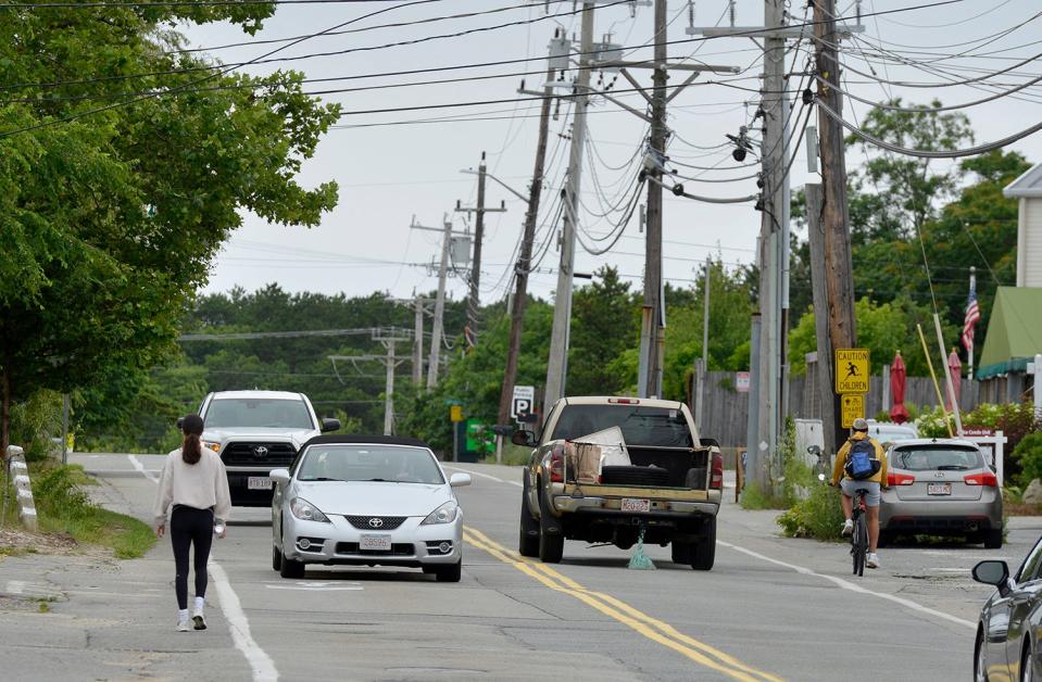 Pedestrians, bicyclists and drivers share Shank Painter Road in Provincetown on Sunday.