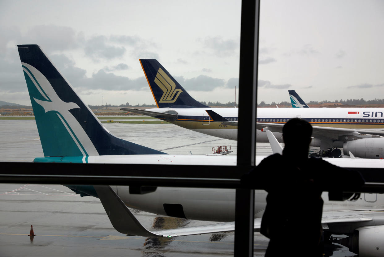 A SilkAir plane sits beside a Singapore Airlines plane at Changi Airport in 2017. (File photo: Reuters/Edgar Su)