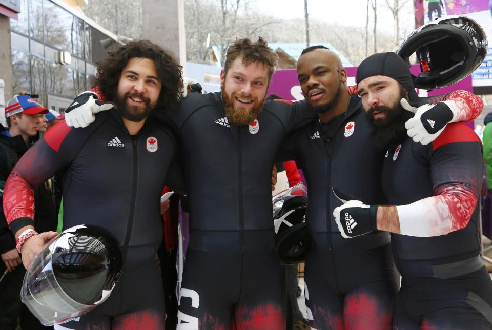 Spring and team mates Randall, McNaughton and Barnett pose at the four-man bobsleigh event of the Sochi 2014 Winter Olympic Games