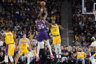Phoenix Suns forward Kevin Durant (35) shoots as Los Angeles Lakers forward Taurean Prince (12) defends during the first half of an NBA preseason basketball game Thursday, Oct. 19, 2023, in Thousand Palms, Calif. (AP Photo/Mark J. Terrill)