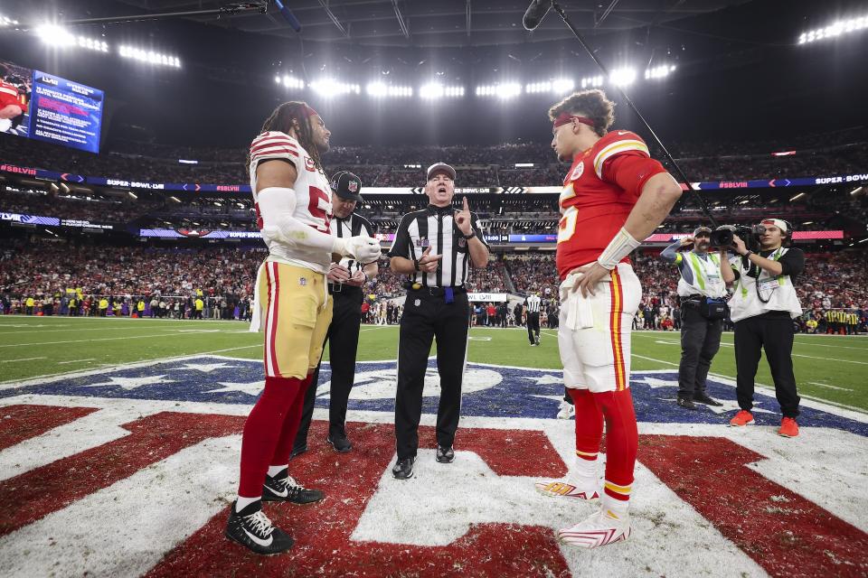 Fred Warner and Patrick Mahomes meet at midfield for the overtime coin toss in Super Bowl LVIII. (Perry Knotts/Getty Images)