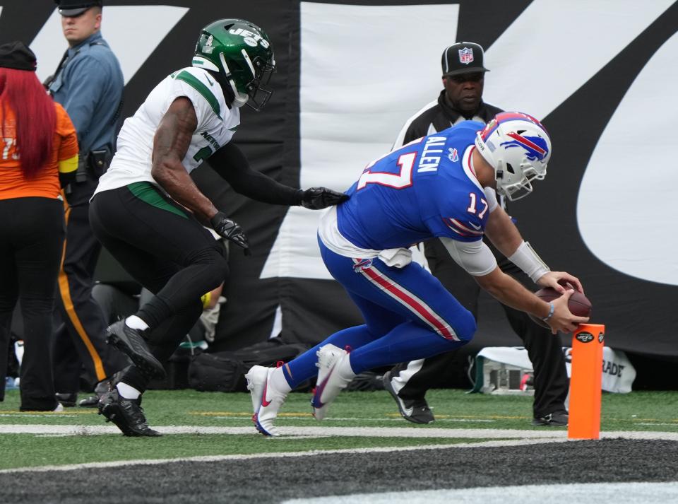 Jordan Whitehead of the Jets can't catch up to Buffalo Bills quarterback, Josh Allen as Allen scores his team's second TD of the first half as the New York Jets host the Buffalo Bills in an AFC East game played at MetLife Stadium in East Rutherford, NJ on November 6 2022.

As The New York Jets Host The Buffalo Bills In An Afc East Game Played At Metlife Stadium In East Rutherford Nj On November 6 2022