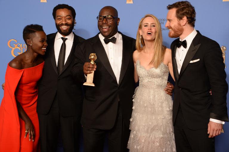 (L-R): Actors Lupita Nyong'o and Chiwetel Ejiofor, director Steve McQueen, actors Sarah Paulson and Michael Fassbender celebrate winning Best Motion Picture - Drama for "12 Years a Slave" at the Golden Globe Awards in Beverly Hills, January 12, 2014