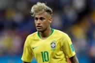 <p>Superstar, supernoodle: Neymar Jr. takes the cake once again for the most offensive haircut in the World Cup. </p><p>Now where to start. Is it the toussled bleached curls that are crying out for a drop of hydration? Is it the extreme fade last seen on a <em>Fresh Prince </em>era Will Smith? Or is it the fact that, despite a comical salary, the Brazilian striker still settles for an aesthetic on par with a Eurovision winner in Republic?</p><p>The beautiful game. Sure.</p>