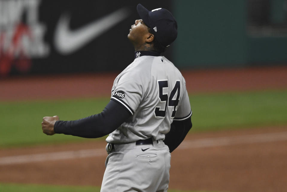 New York Yankees relief pitcher Aroldis Chapman reacts after the Yankees defeated the Cleveland Indians 10-9 in Game 2 of an American League wild-card baseball series, early Thursday, Oct. 1, 2020, in Cleveland. (AP Photo/David Dermer)