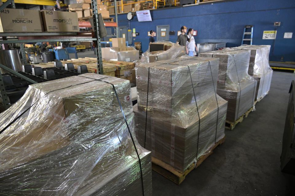 Pallets containing a shipment of 9mm SUB2000 rifles await shipment to Ukraine at the KelTec gun manufacturing facility on Thursday, March 17, 2022, in Cocoa, Fla. The family-owned gun company was left holding a $200,000 shipment of semi-automatic rifles after a longtime customer in Odessa suddenly went silent during Vladimir Putin’s invasion of Ukraine. Fearing the worst, the company decided to put those stranded 400 guns to good use, sending them to Ukraine's nascent resistance movement. (AP Photo/Phelan M. Ebenhack)