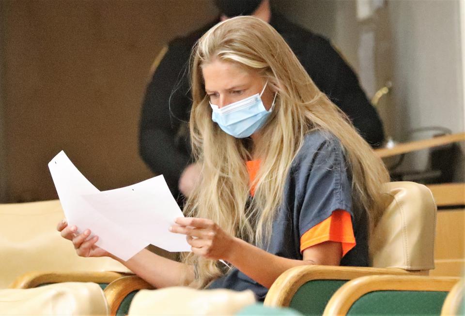 Arson suspect Alexandra Souverneva looks over papers during her appearance in Shasta County Superior Court on Friday afternoon, Sept. 24, 2021.