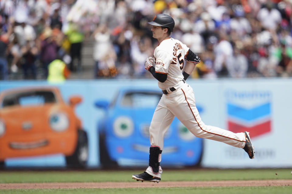 San Francisco Giants' Mike Yastrzemski rounds the bases after hitting a home run against the Los Angeles Dodgers during the first inning of a baseball game in San Francisco, Sunday, June 12, 2022. (AP Photo/Jeff Chiu)