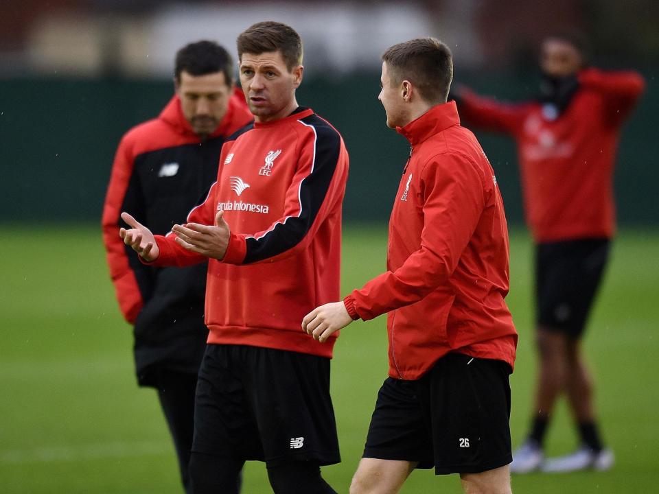 Gerrard will take up a full-time position with Liverpool's academy (Getty)