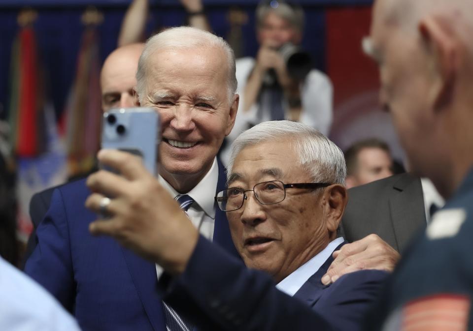 President Joe Biden poses for photos with attendees after he delivered remarks on the one-year anniversary of passage of the PACT Act, the most significant expansion of benefits and services for toxic exposed veterans and survivors in over 30 years, at the George E. Wahlen Department of Veterans Affairs Medical Center in Salt Lake City on Thursday, Aug. 10, 2023. | Laura Seitz, Deseret News