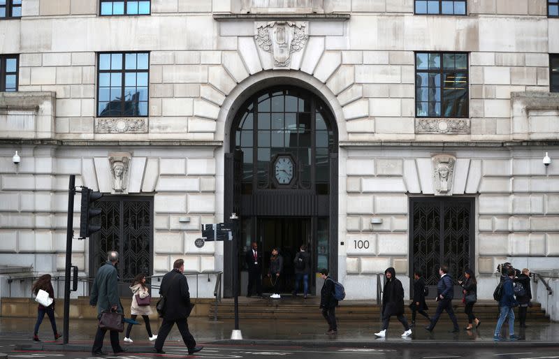 People walk in front of the Unilever building in central London