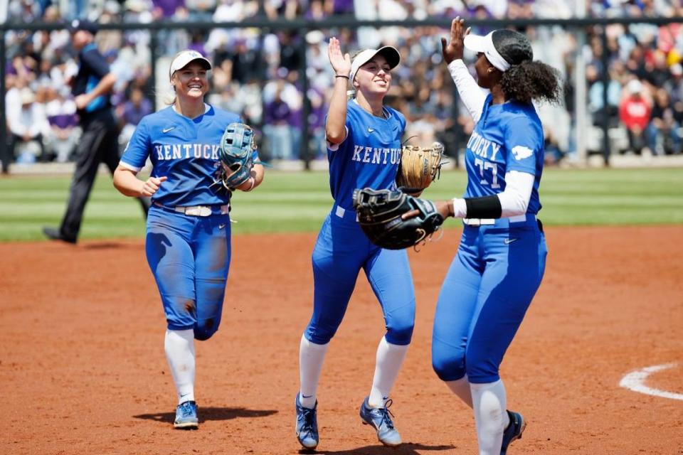 Kentucky infielders Margaret Tobias, center, and Meeko Harrison, right, celebrate a double play against No. 3 Stanford on Friday in San Diego.