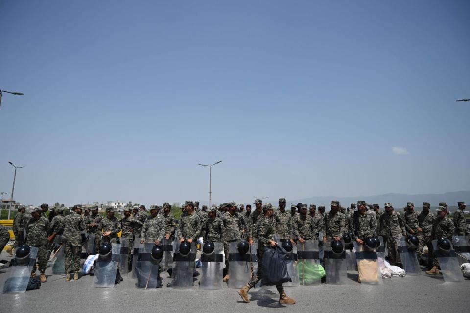 Rangers paramilitary personnel assemble near a blocked bridge along a road in Islamabad  on Wednesday (Aamir Qureshi/AFP/Getty)