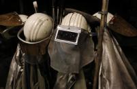 Protective coats and helmets are seen at a casting roller at ThyssenKrupp Steel Europe AG in Duisburg November 29, 2013. REUTERS/Ina Fassbender