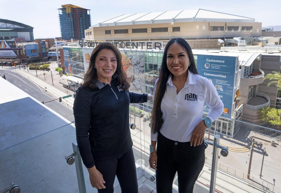 GinaMarie Scarpa, co-founder and CEO of NABI Foundation, (left) and Lynette Lewis, director of basketball operations and program development at NABI foundation are busy preparing for the Native American Basketball Invitational at Footprint Center.