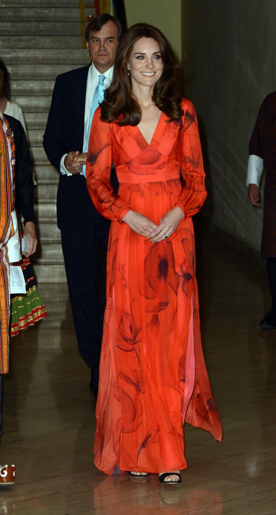 <p>On the royal tour of Bhutan, Kate turned out in a gorgeous red chiffon gown by Beula London. Featuring an abstract poppy print and a barely noticeable slit, the Duchess looked every inch the princess. <i>[Photo: PA]</i> </p>