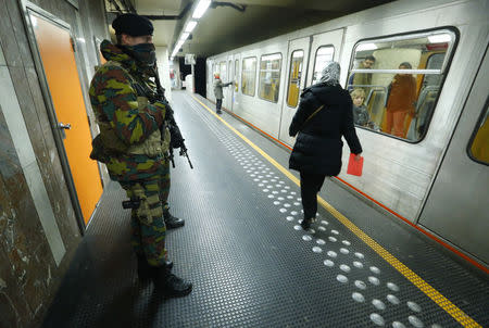 Belgian soldiers patrol in a subway station in Brussels, Belgium, November 25, 2015. REUTERS/Yves Herman