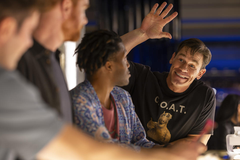 This image released by Amazon Prime shows John Cena, right, in a scene from "Ricky Stanicky." (Ben King/Amazon via AP)