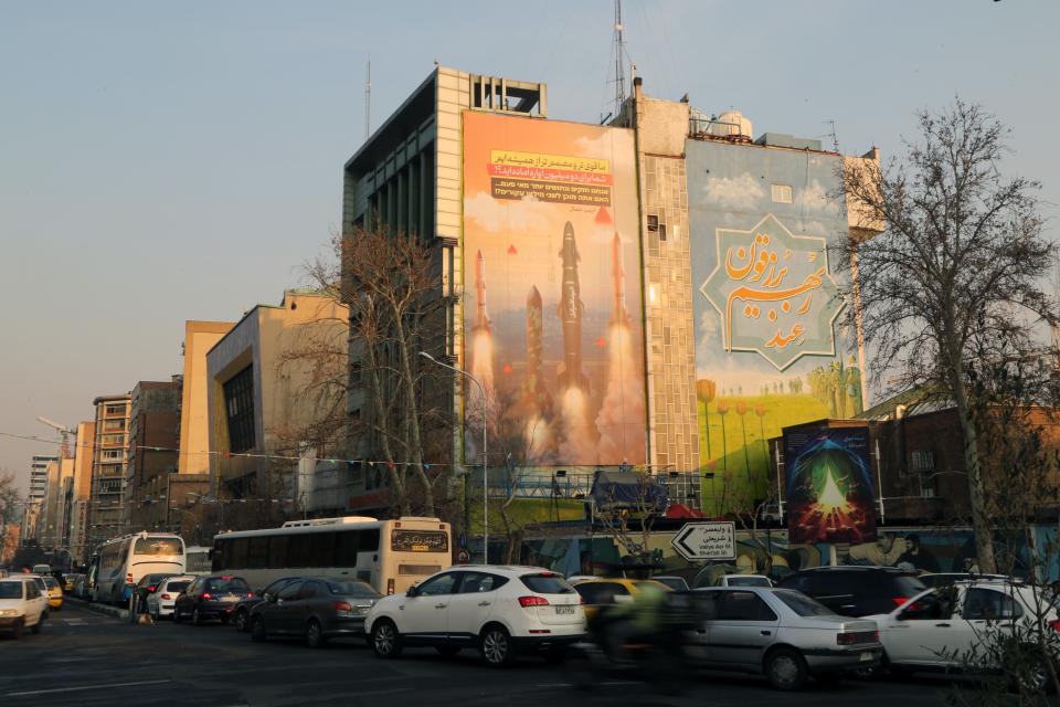 A view of a banner hung on a building reading in Persian and Hebrew 'We are stronger and more motivated than ever. Are you ready for 2 million displaced people?' with pictures of Iranian missiles as tensions between Iran and Israel continue to escalate in Palestine Square of the capital Tehran, Iran on February 20, 2024.