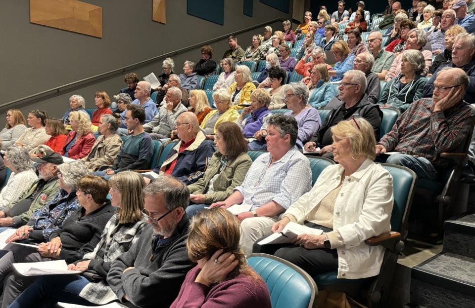 Residents fill the auditorium in the Pratt & Whitney Building at York County Community College during a Wells Select Board meeting on April 16, 2024. Many of them spoke during a public hearing for a proposed moratorium on large-scale housing projects in the community.